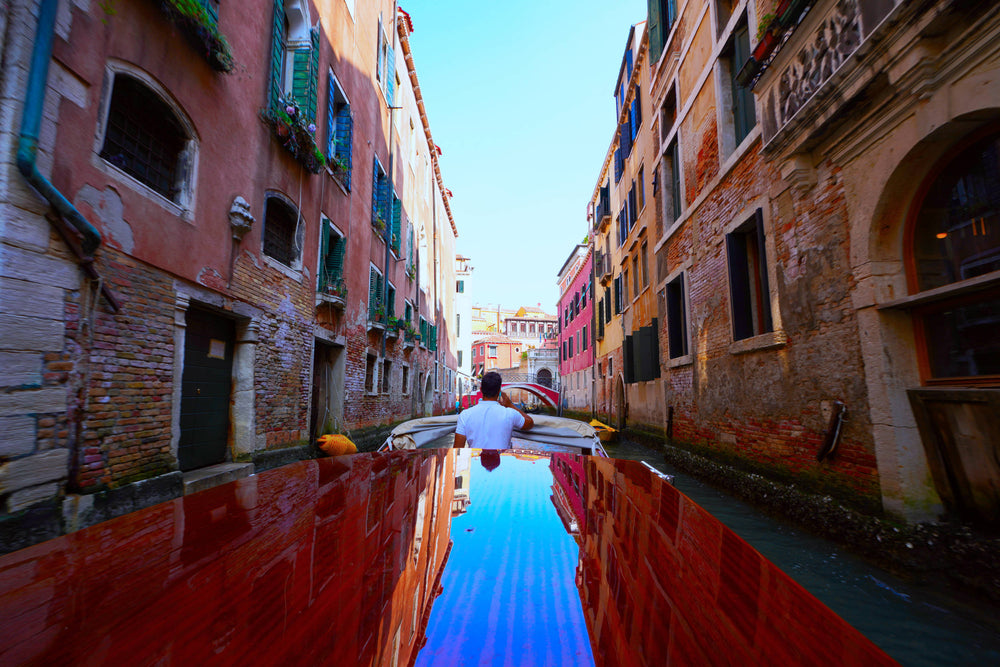 Shining Taxi Navigating Venice Canal